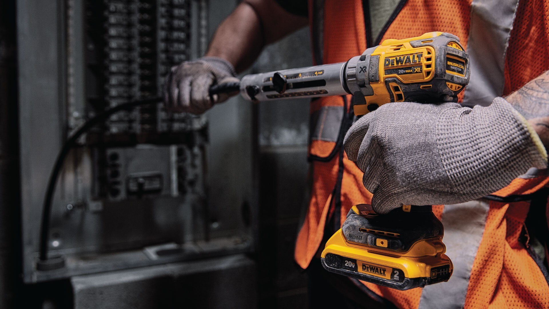 A construction pro using a DEWALT Powerstack drill on a job site
