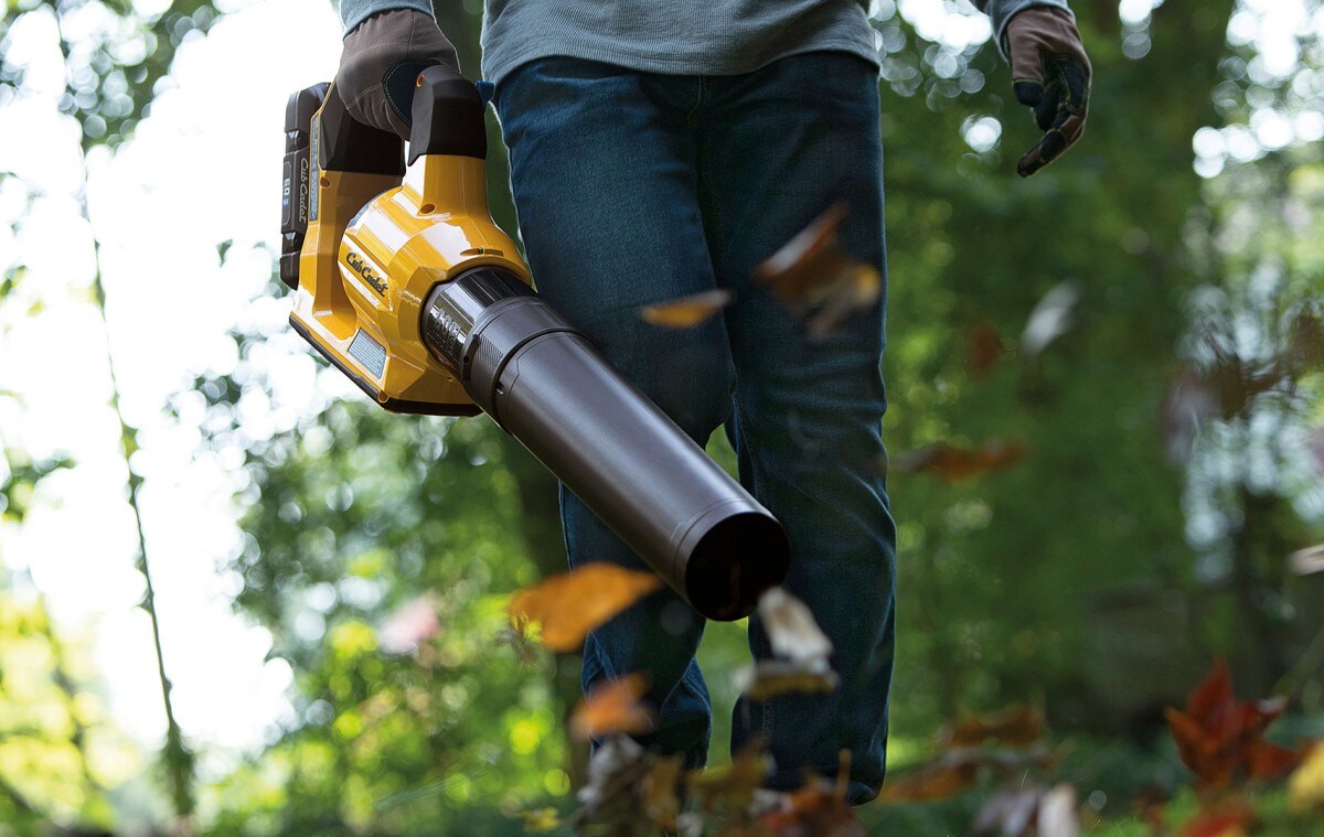 A person using a leaf blower